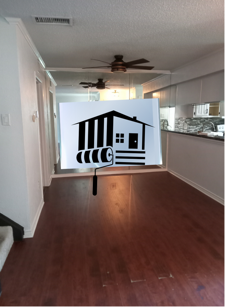 graphyxo art house and paint roller displayed over a home interior