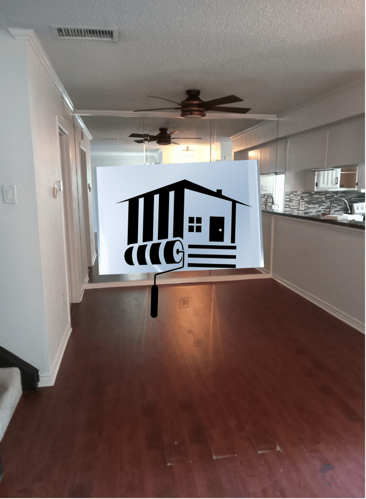 graphyxo art house and paint roller displayed over a home interior